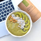 breakfast bowl of your superfoods power matcha sitting on macbook pro keyboard 